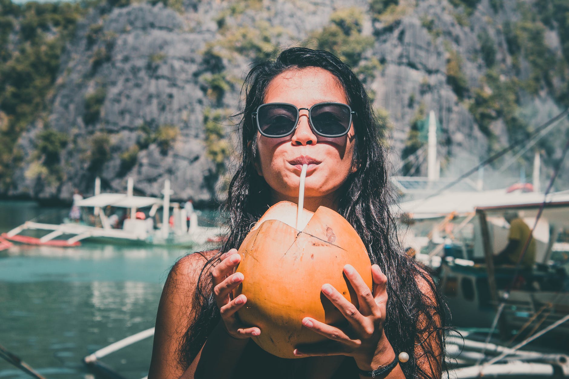 photo of girl drinking coconut