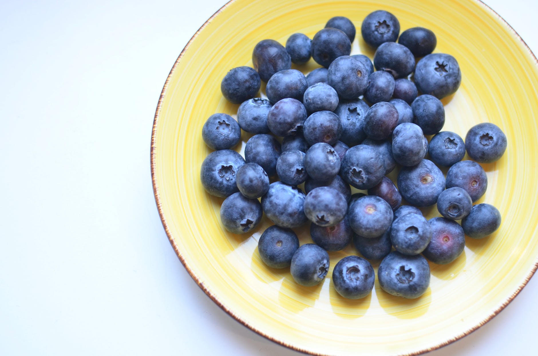tasty ripe blueberry on white table